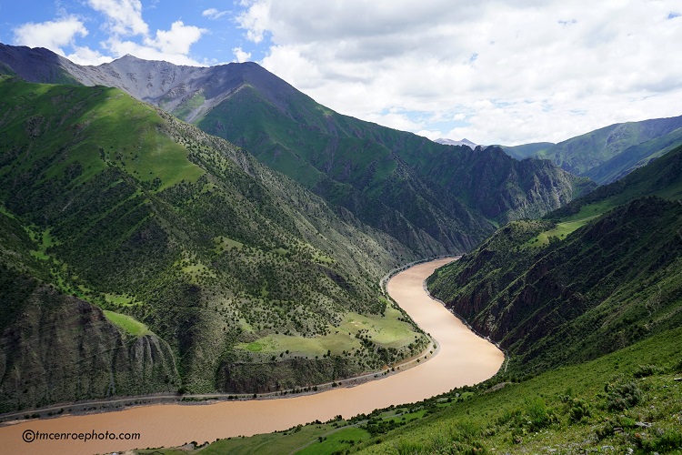 Shot of a river winding through the mountains in Tibet 