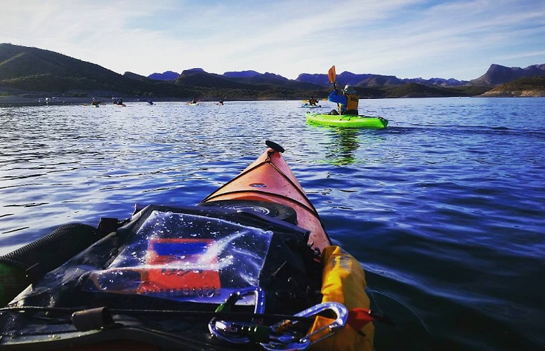 Aleutian Deck Bag on a kayak while paddling on a lake