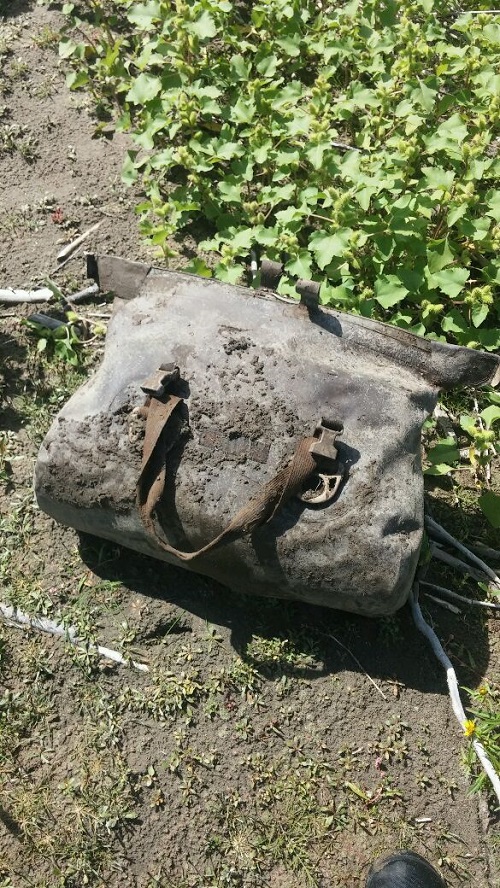 The found Watershed bag with dirt all over it