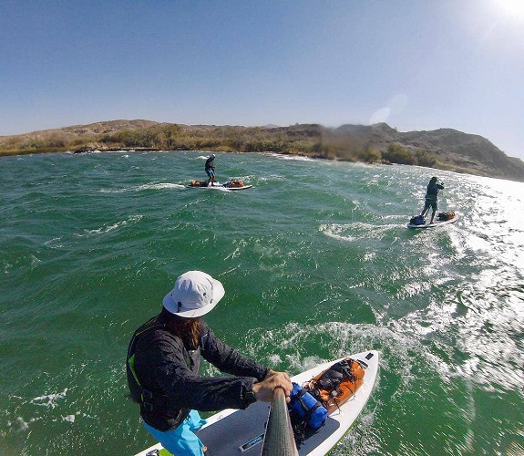 Man on a SUP board down the river